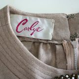 50s Carlye fawn dress label